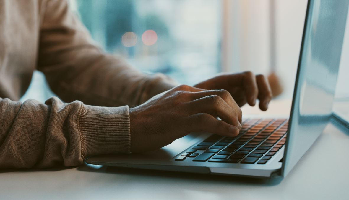 Person typing on a laptop